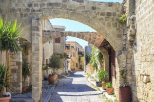 Historical-streets-of-old-town-Rhodes-with-flowers-in-Rhodes-Dodecanese-Greece-cm