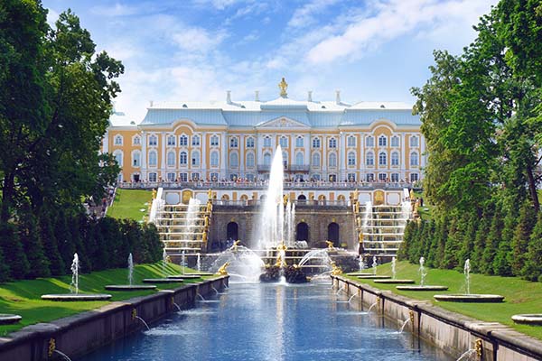 Saint Petersburg, Russia - July 9, 2013: Tourists walk near Petrodvoretz (Peter I Palace) and Grand Cascade Fountain in the Saint Petersburg.