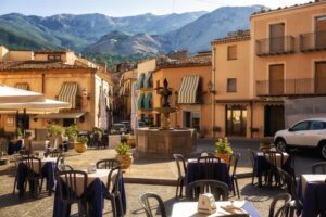 Castelbuono, ITALY - August, 4, 2023. Fountain and cafes -cm