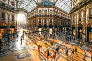 Crowd of people in Galleria Vittorio Emanuele II at sunset, Milan, Italy-cm