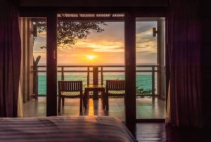 Ocean sunset view from bedroom balcony for travel concept. -cm