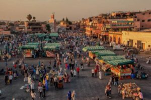 Golden Hour at Jemaa el-Fna Square with Orange Juice Stalls and Restaurants, Marrakech, Morocco-cm