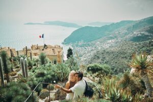 Happy millennial couple, exploring the historic village of Eze in the south of France, while on vacation-cm