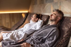 Young couple lying on the tepidarium beds in the spa-cm